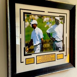 Framed photo of Tiger Woods and Michael Jordan playing golf